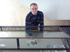 Bruce Calvert sets up a display case with treasures