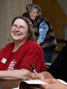 The nice smile of Jane Bartholomew, with Marilyn Schroeder standing behind her