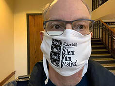 Bruce Calvert wears his timely Kansas Silent Film Festival Covid mask