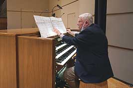 Organist Marvin Faulwell prepares to play the White Concert Hall organ