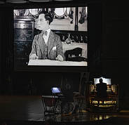 Buster Keaton on the screen in "The Navigator" while Bob Keckeisen and Marvin Faulwell accompany the showing
