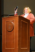 Denise Morrison welcomes attendees back to White Concert Hall after lunch hour on Saturday afternoon