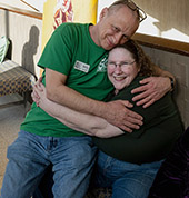 Deep hug between Larry Stendebach and Jane Bartholomew